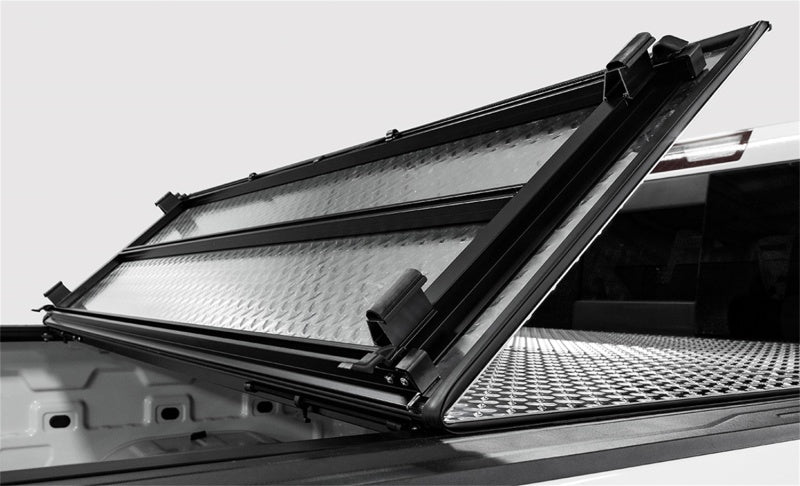 Access LOMAX Tri-Fold Hard Tonneau Cover for 2019-2020 Ram 1500 with 5' 7" Bed (W/O RamBox) - Black Urethane